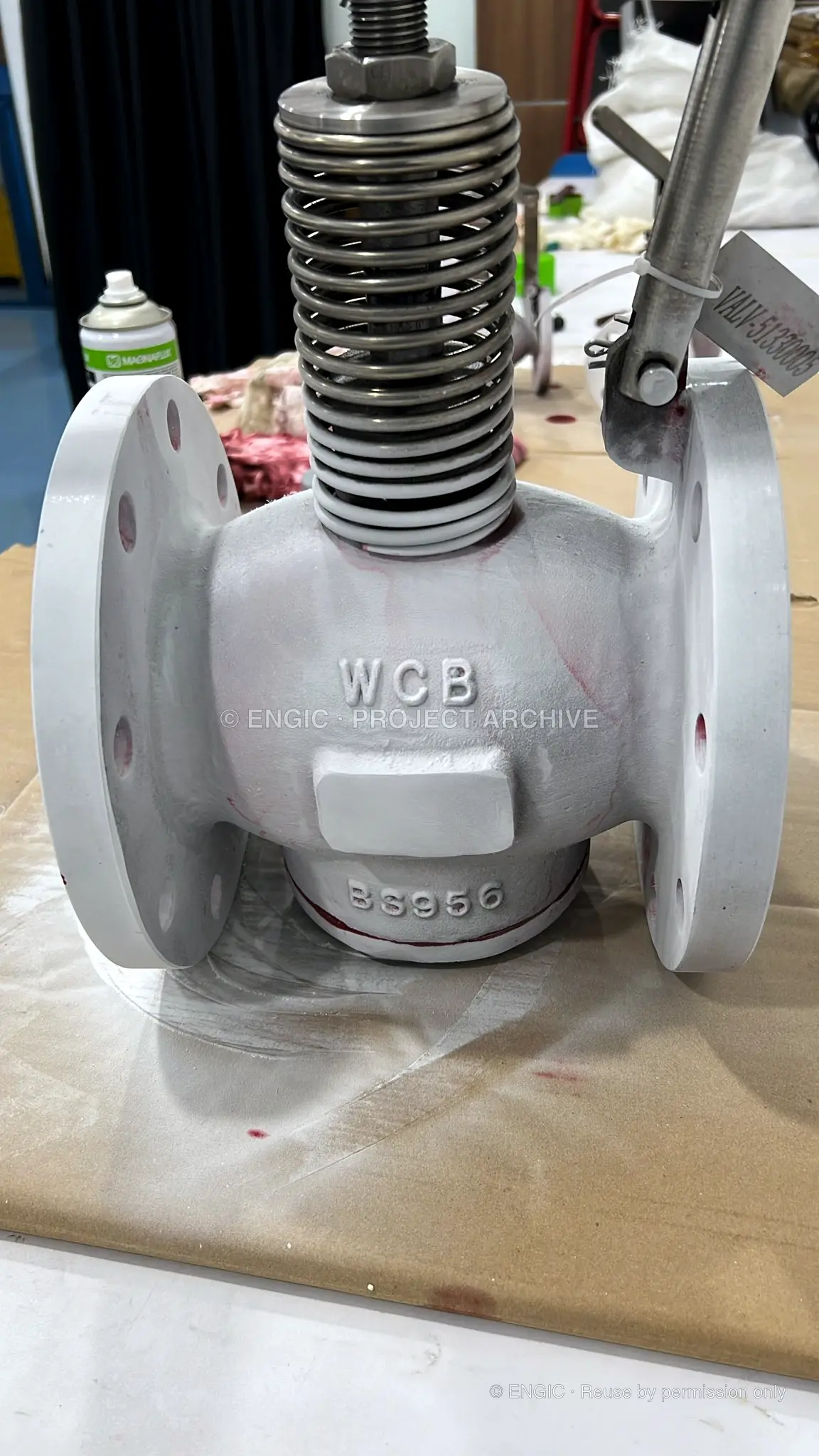Developer-coated valve checked for surface indications during dye penetrant testing