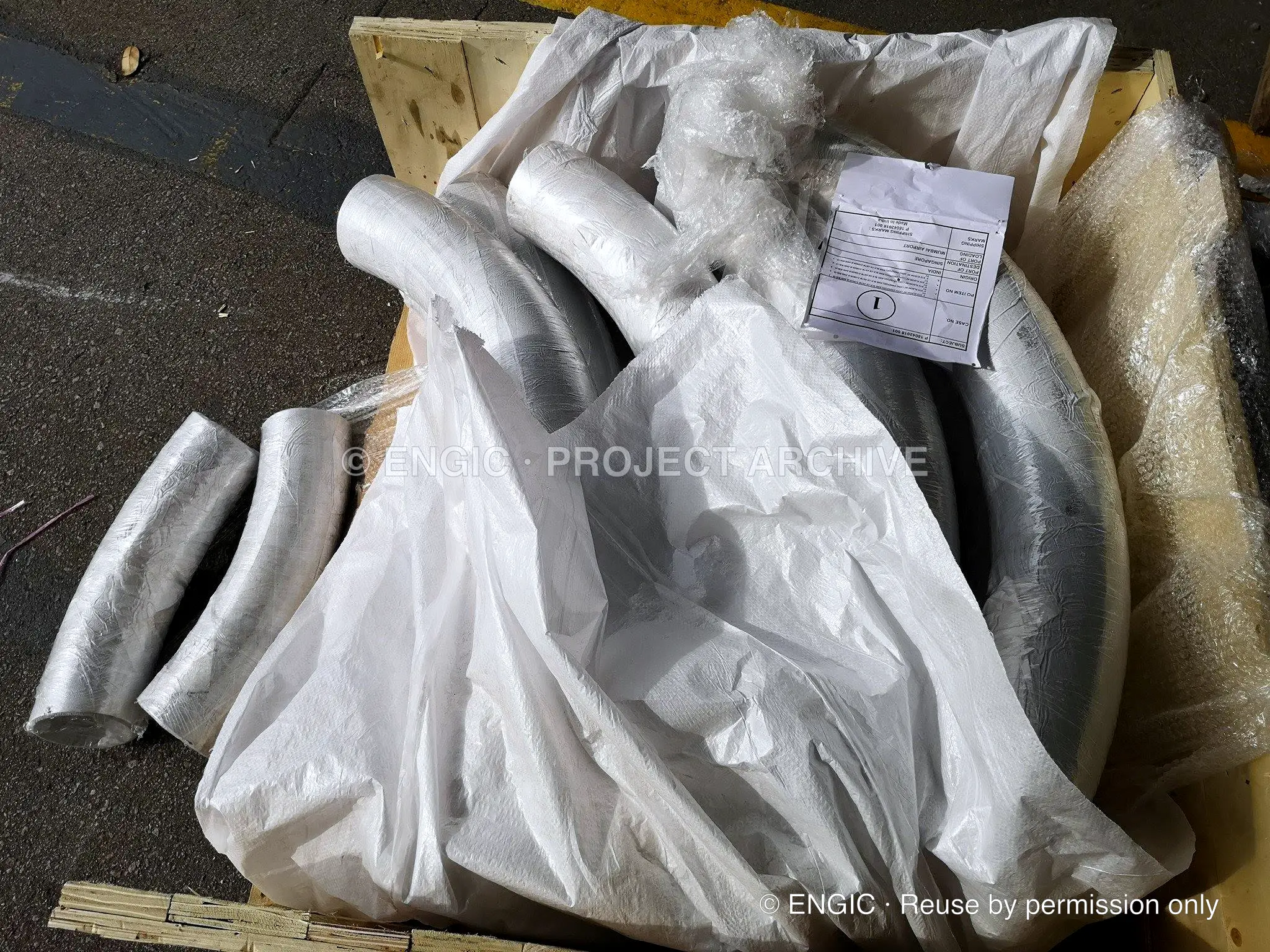 Wrapped and bagged pipe fittings palletised for despatch