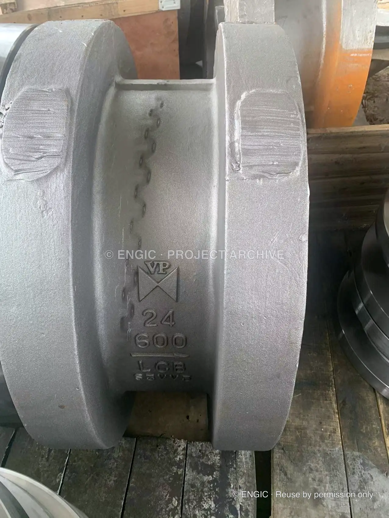A large cast wafer check valve body marked 24 inch, Class 600 and WCB