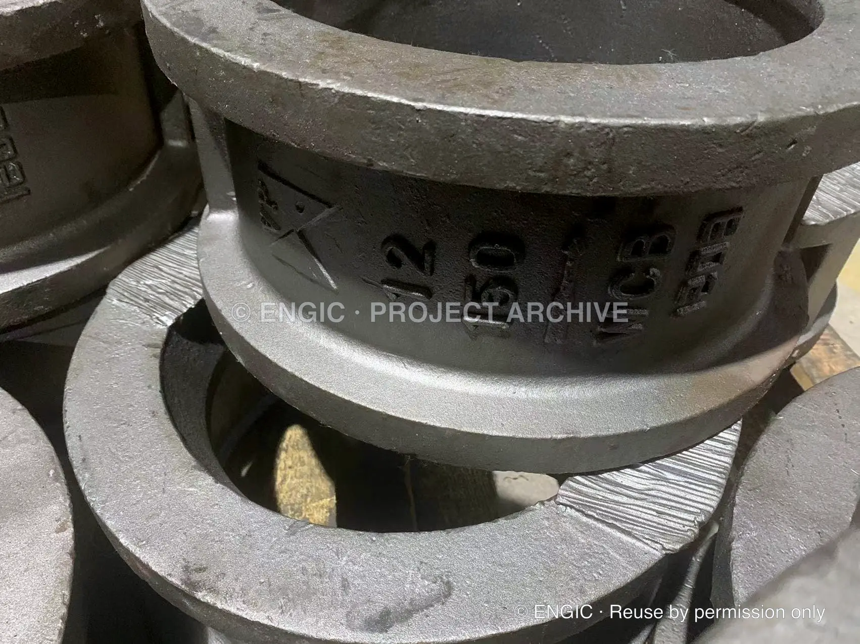 Close view of size, pressure class and WCB material markings on a cast wafer check valve body