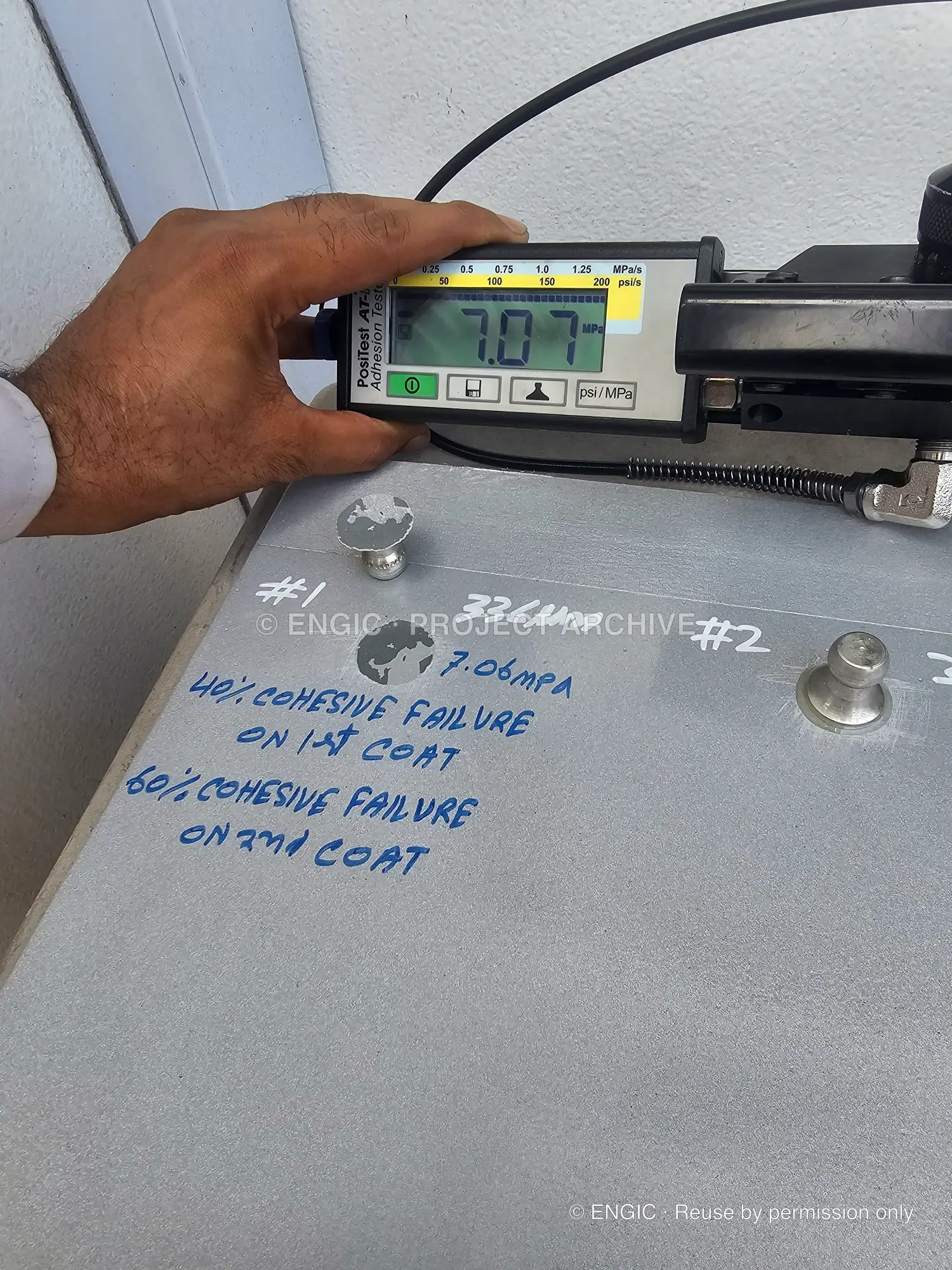 A coating adhesion test being recorded on a valve body