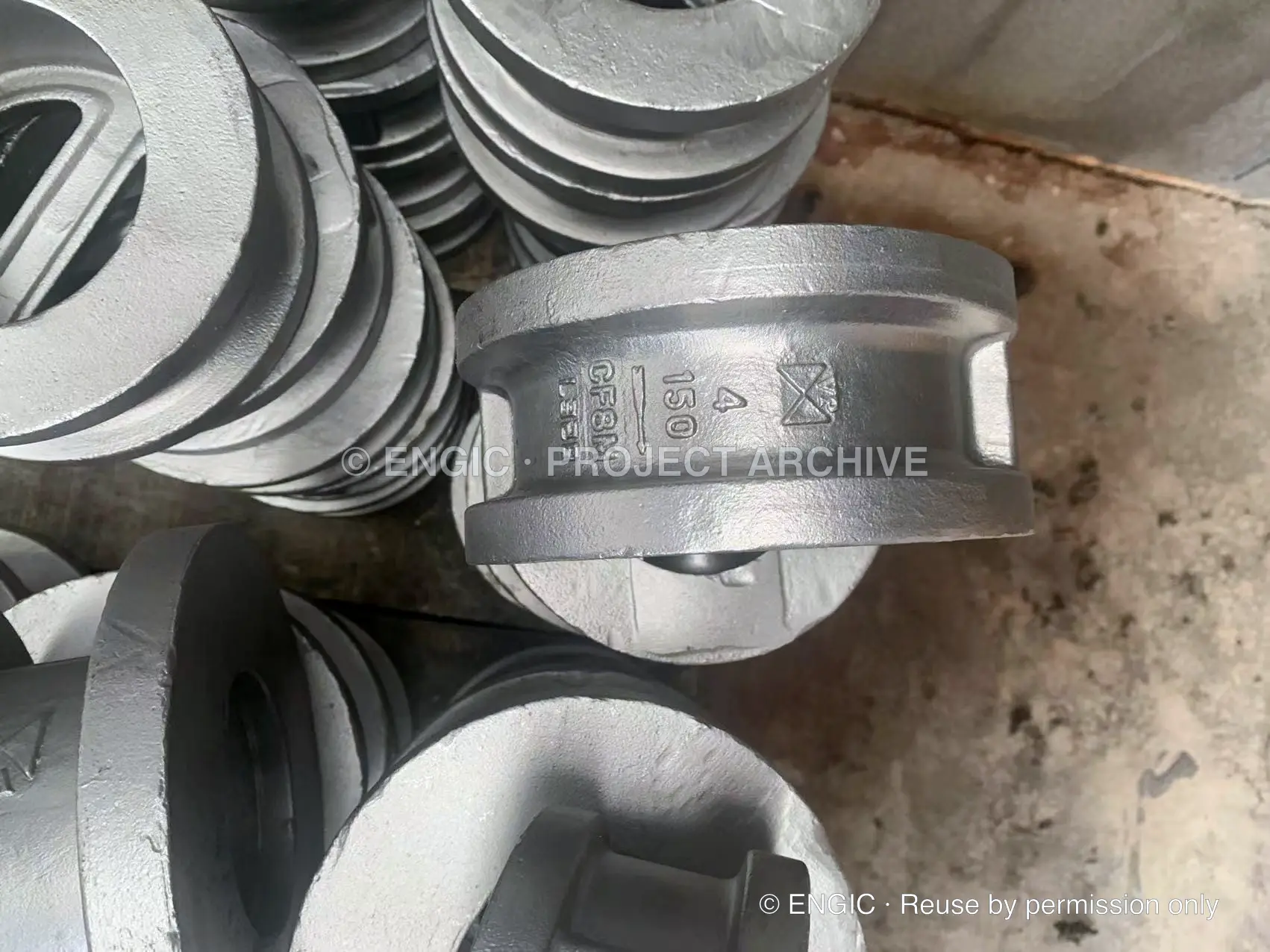 Cast dual-plate wafer check valves arranged together for inspection