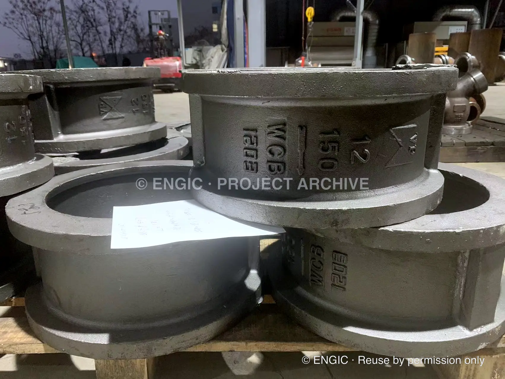 Cast dual-plate wafer check valves marked by size, pressure class and WCB body material